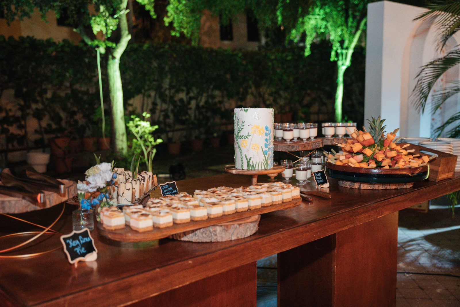Cailey and Noel's wedding reception features a dessert table with various treats at the Avila Beach Hotel in Curaçao